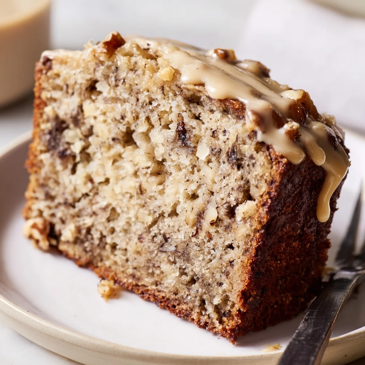 Moist coffee cream banana bread slices adorned with chocolate chips and nuts.  