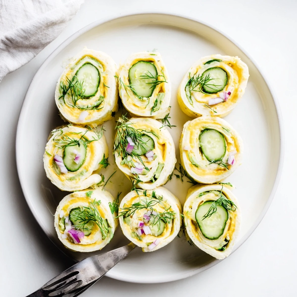 Crispy Pickle-in-a-Blanket rolls filled with cream cheese and cheddar.