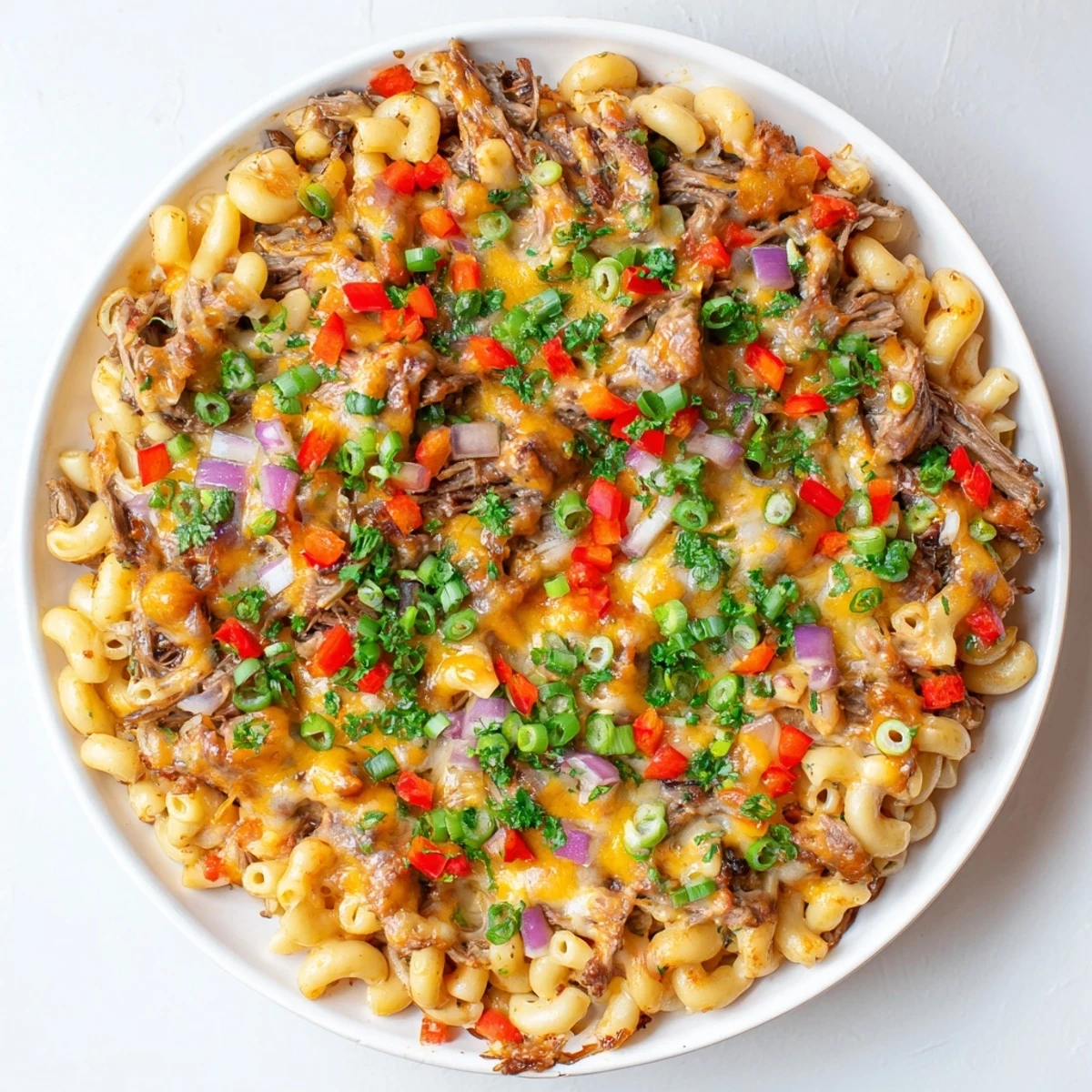 BBQ Rib Macaroni Skillet bubbling hot from the oven, with melted cheese and tender rib meat.