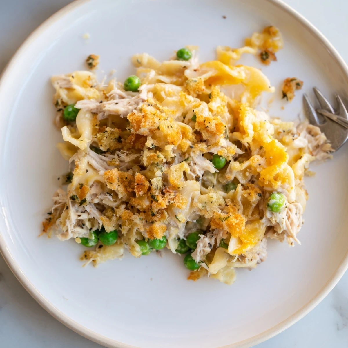 Golden-brown Creamy Tuna Noodle Casserole with a bubbly, cheese-topped deliciousness awaiting serving.