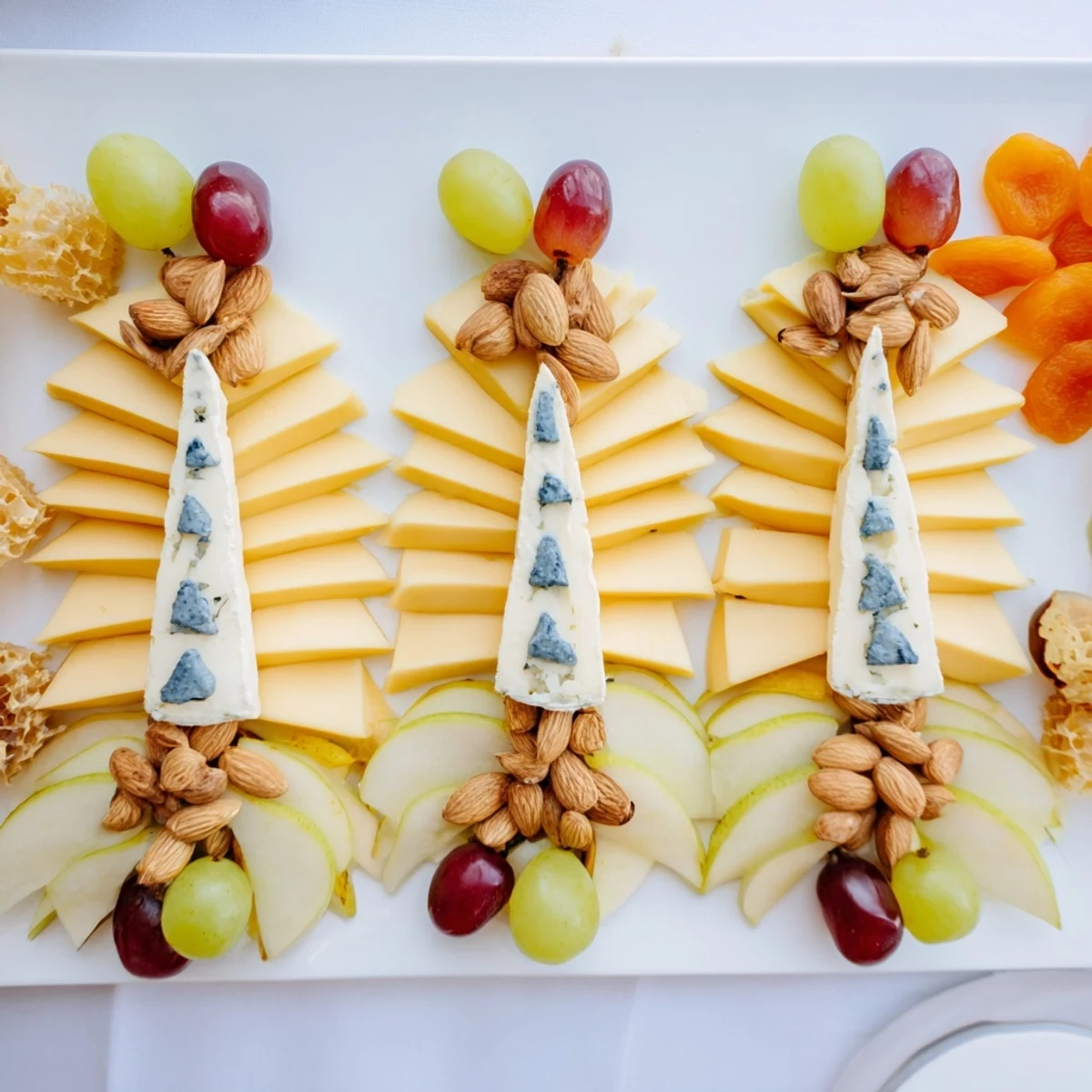 See this beautiful Art Deco Arch Cheese Platter: an elegant appetizer with layered cheese and fruit.