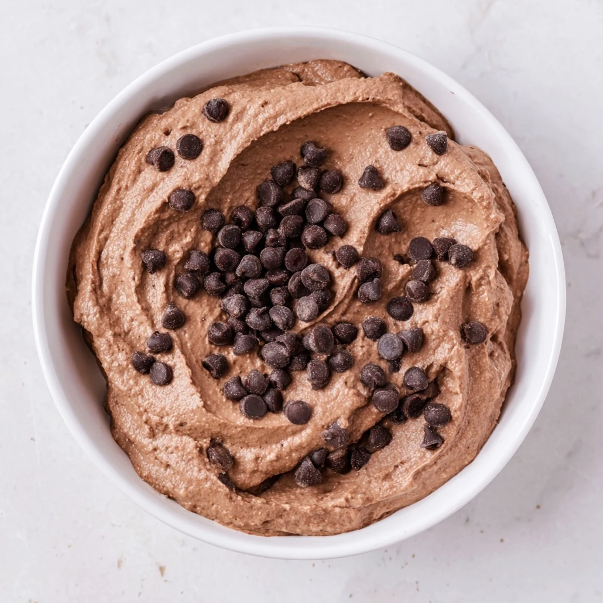 Creamy gluten-free brownie batter dip, rich chocolate dessert, ready for dipping fruits and cookies.