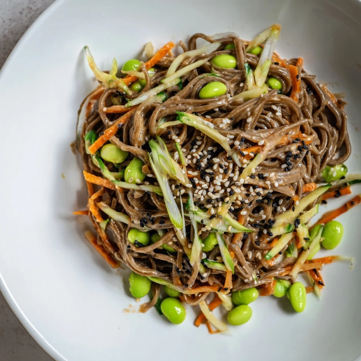 Vibrant Asian sesame noodle salad with fresh veggies and a creamy, flavorful dressing for lunch.