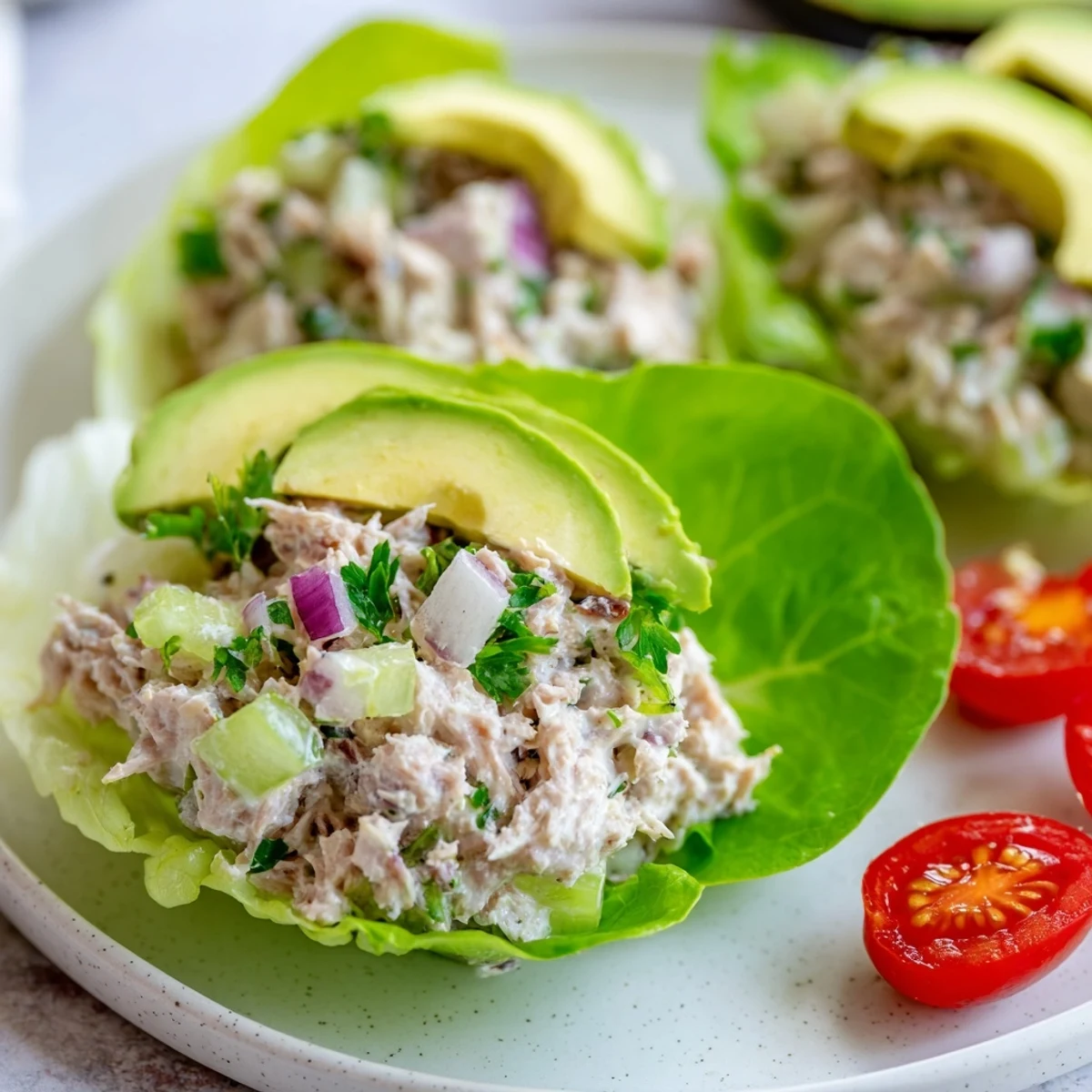 Perfectly formed tuna salad lettuce wraps, filled generously with savory tuna and fresh veggies.