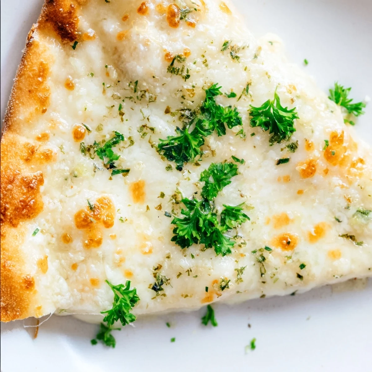 Golden bubbly mozzarella blankets a crisp crust, generously slathered with a rich, aromatic garlic cream sauce in this homemade Creamy Garlic White Pizza.