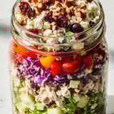 Vibrant Layered Holiday Chopped Chicken Salad Jar, featuring juicy chicken and a creamy, tangy dressing.
