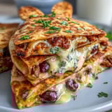 Adorable bunny-shaped quesadillas filled with gooey cheese and colorful veggies, perfect for Easter celebrations with kids.