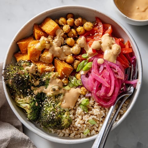 Vibrant Bold Sauce Drizzle Bowls topped with roasted vegetables and zesty miso-butter sauce.  