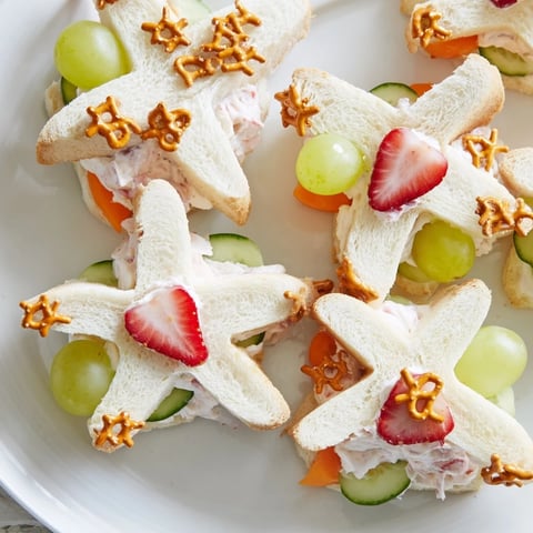 Vibrant Beach Day Starfish snack platter filled with playful sandwiches, fresh fruits, and crunchy treats.