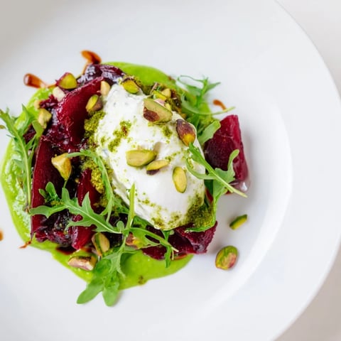 Elegant Lucky Clover Seasonal Starters, with colorful pea purée and creamy goat cheese, ready to enjoy.