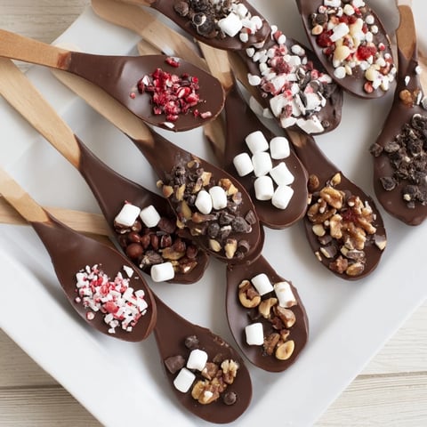 Enjoy this festive Hot Chocolate Spoon Toppings Board, a delicious dessert with various sweet treats.