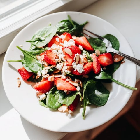 Strawberry Spinach Salad: A colorful mix of strawberries, spinach, and feta, drizzled with vinaigrette.
