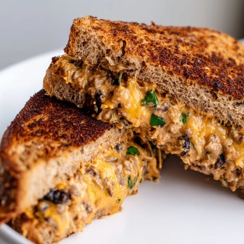 Golden-brown Black Bean Grilled Cheese, oozing melted cheese, a flavorful and easy vegetarian meal.