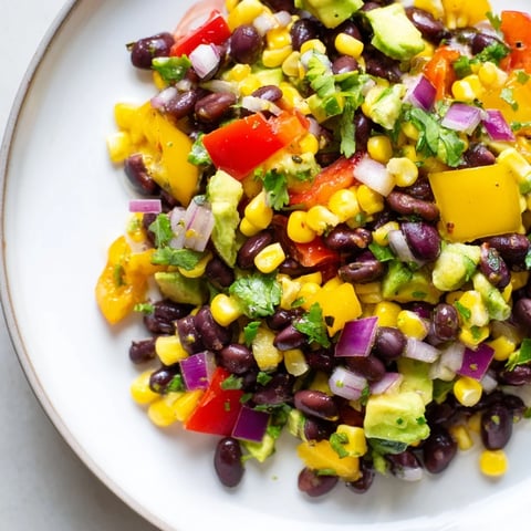 A bowl of colorful Southwest Black Bean Salad, full of fresh ingredients and vibrant flavors.