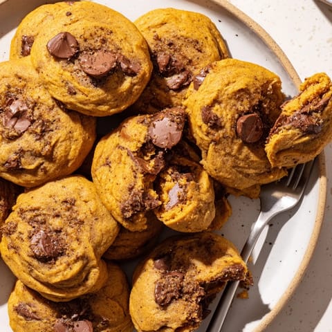 Irresistibly spiced pumpkin chocolate chip cookies, topped with creamy toasted pecan butter drizzle.  
