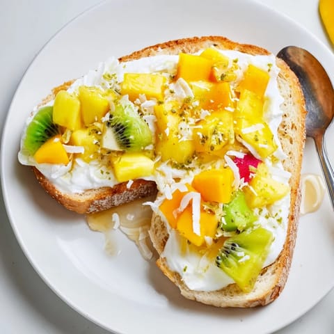 Vibrant Yogurt-Custard Toast with juicy fruits and a touch of coconut bliss.  