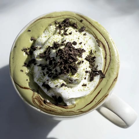 A close-up of a vibrant Matcha Hot Cocoa Protein Mug ready for a quick and nutritious breakfast.
