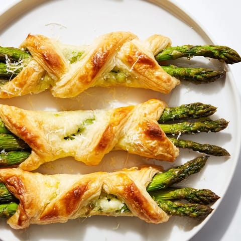 Freshly baked Star Shaped Asparagus Bundle Wraps, showcasing tender asparagus within flaky pastry stars.