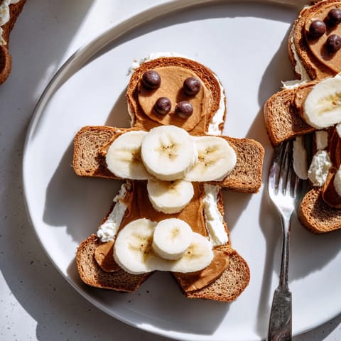 Sweet gingerbread man sandwich cutouts decorated with happy faces in a whimsical lunch.