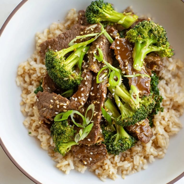Close-up of Slow-Cooker Beef & Broccoli: savory sauce coats the beef and crisp broccoli florets.