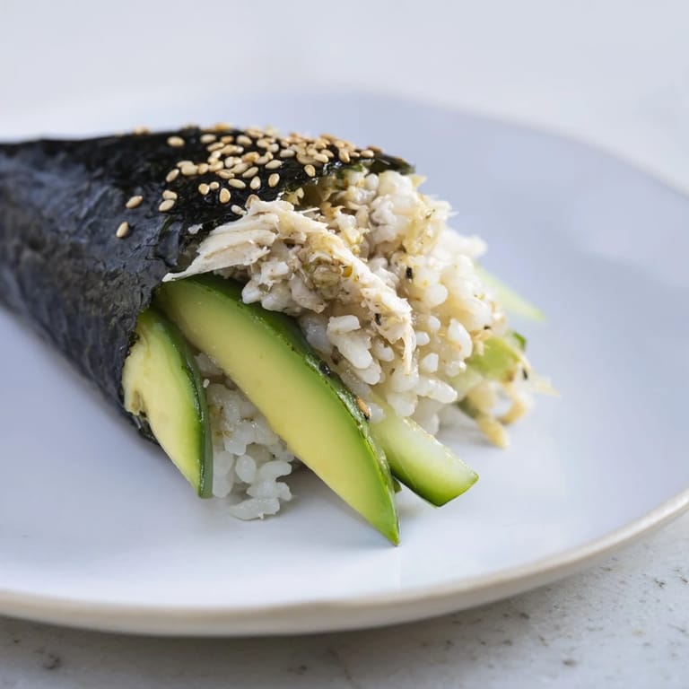 A close-up of delicious Sushi Rice Hand Rolls with colorful fillings and crisp seaweed wrappers.