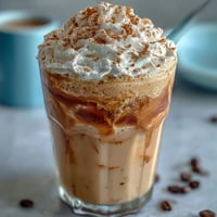 Creamy vanilla protein shake with real vanilla bean paste, blended with almond milk and ice for a refreshing treat.