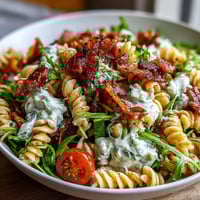 Fresh BLT Pasta Salad with Bacon and Avocado, a colorful mix of creamy avocado, crispy bacon, and juicy cherry tomatoes over pasta.